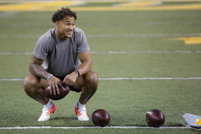 Trey Lance smiles during a break in his pro day performance